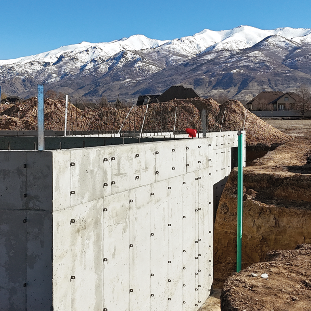 A stripped wall formed by jeff dumas concrete construction, a concrete contractor in west jordan, UT, is smooth and durable thanks to the use of aluminum forms.
