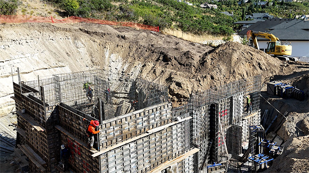 20-foot custom foundation walls being built by a concrete contractor Utah in Sandy using aluminum formwork