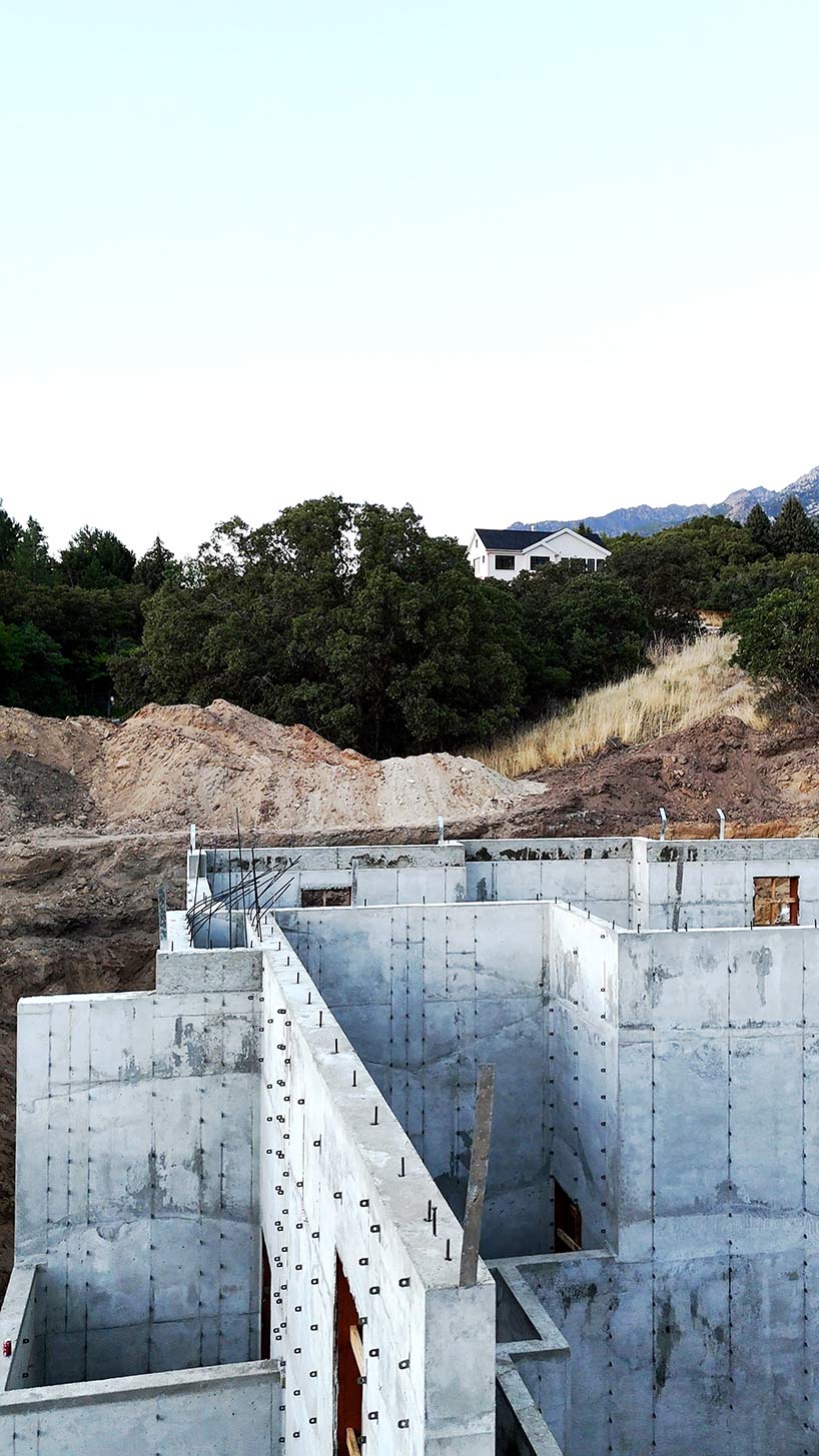 Concrete foundation contractors building reinforced concrete walls for a custom home foundation in the Pepperwood Community in Sandy Utah